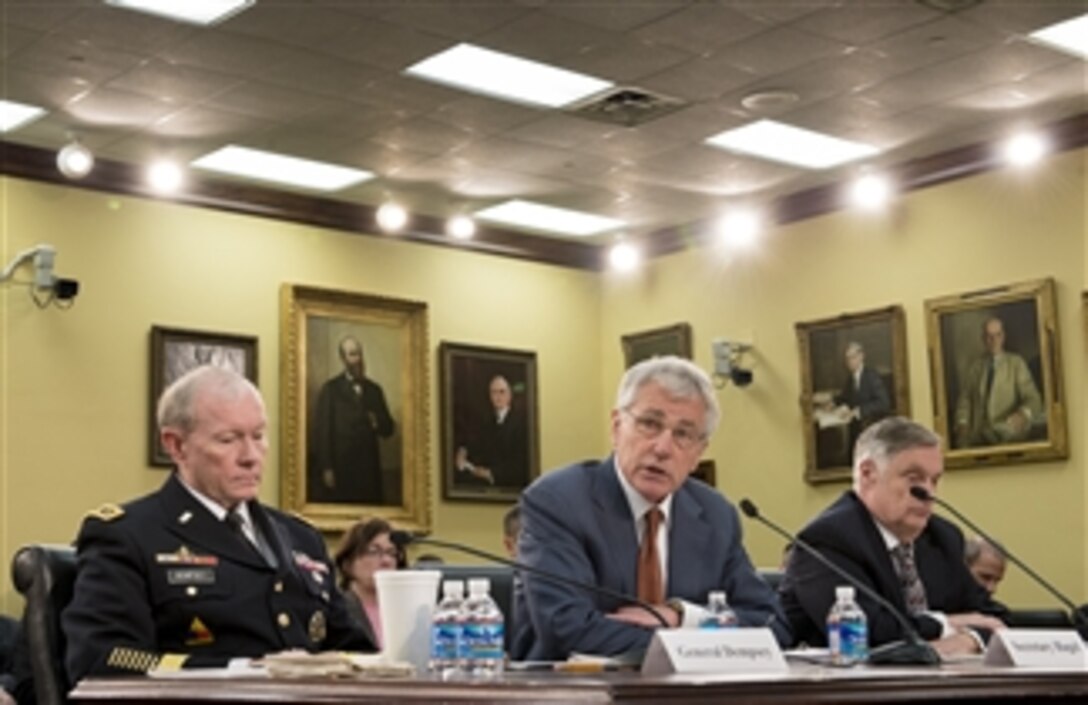 Defense Secretary Chuck Hagel testifies on the Defense Department's fiscal year 2015 budget request as Army Gen. Martin E. Dempsey, chairman of the Joint Chiefs of Staff, and Robert F. Hale, the department's comptroller, look on before the House Appropriations Committee's defense subcommittee in Washington, D.C., March 13, 2014.