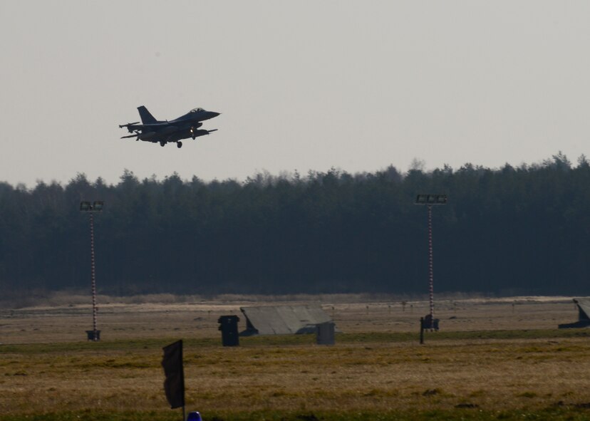 An F-16 Fighting Falcon assigned to the 555th Fighter Squadron from Aviano Air Base, Italy, lands March 14, 2014, at Lask Air Base, Poland. A total of twelve 555th Fighter Squadron F-16s and more than 200 service members arrived to augment an off-site training event, which demonstrates an enduring partnership with NATO allies. (U.S. Air Force photo/Airman 1st Class Ryan Conroy) 
