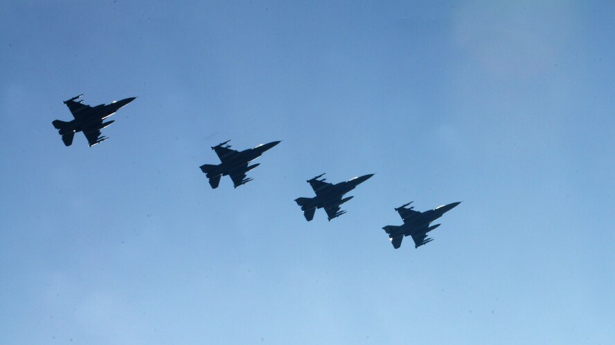 Four F-16 Fighting Falcons assigned to the 555th Fighter Squadron from Aviano Air Base, Italy, fly in formation prior to landing March 14, 2014, at Lask Air Base, Poland. A total of twelve 555th Fighter Squadron F-16s and more than 200 service members arrived to augment an off-site training event, which demonstrates an enduring partnership with NATO allies. (U.S. Air Force photo/Airman 1st Class Ryan Conroy)
