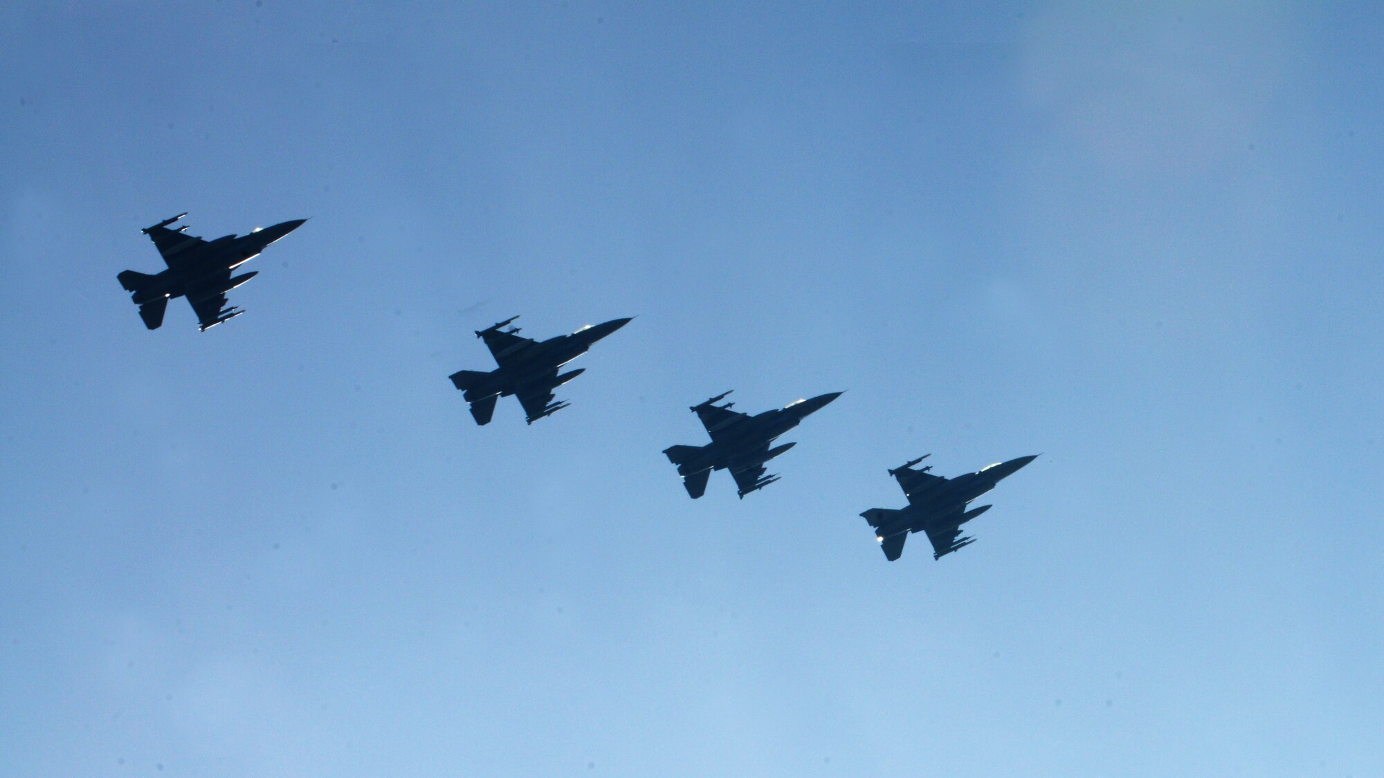 Four F-16 Fighting Falcons assigned to the 555th Fighter Squadron at Aviano Air Base, Italy, fly in formation prior to landing, March 14, 2014, at Lask Air Base, Poland. A total of twelve 555th Fighter Squadron F-16 Fighting Falcons and 200 military personnel arrived to augment an off-site training event, which demonstrates an enduring partnership with NATO allies.  (U.S. Air Force photo/Airman 1st Class Ryan Conroy)  