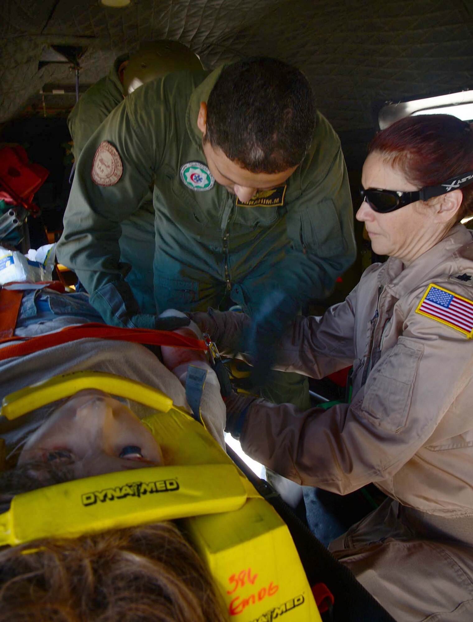 Lt. Col. Robyn Kramer, 386th Expeditionary Medical Group flight surgeon, participates in a host nation joint medical evacuation of a simulated patient at an undisclosed location in Southwest Asia. Kramer is deployed from Luke Air Force and a native Phoenix, AZ. (U.S. Air Force photo by Senior Airman Desiree W. Moye)