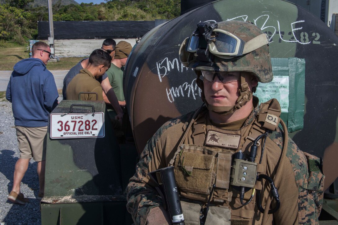 A Marine attached to the Maritime Raid Force, 31st Marine Expeditionary Unit, provides security near a potable water bowl as role-players flock to receive water at a mock foreign village, March 16. The 31st MEU provided humanitarian assistance and disaster relief supplies to a village devastated by an earthquake, requiring the delivery of 26,000 gallons of water and additional food and aid items. The HA/DR training is in support of the 31st MEU’s Certification Exercise, a training package that tests the capabilities of the MEU in a variety of scenarios and is evaluated by members of the Special Operations Training Group, III Marine Expeditionary Force.