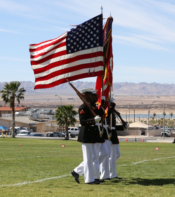 The Marine Corps Color Guard marches during the annual Battle Color Ceremony at Lance Cpl. Torrey L. Gray Field, March 12, 2014. The 54 streamers attached to the colors represent differents portions of the Marine Corps' history. (Official Marine Corps photo by Cpl. Alejandro Bedoya/ Released)