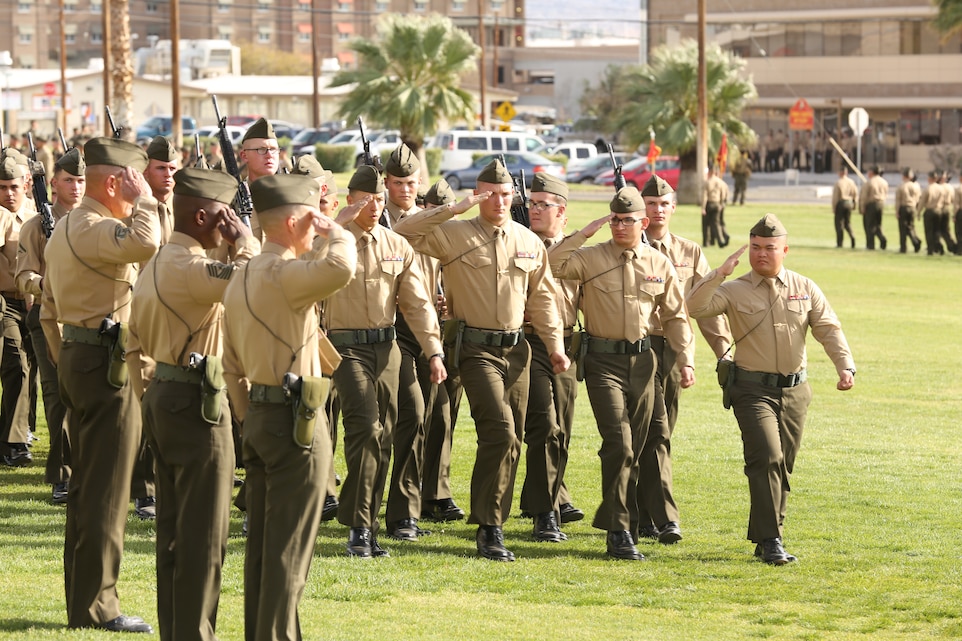 Marines with 7th Marine Regiment conduct a pass and review during a relief and appointment and retirement ceremony for 7th Marine Regiment's sergeant major at Lance Cpl. Torrey L. Gray Field, Mar. 7. Distinguished guests, families and friends were invited to wish fair winds and following seas to Sgt. Maj. Scott A. Samuels and welcome the incoming sergeant major, Sgt. Maj. Rodney L. Lane.