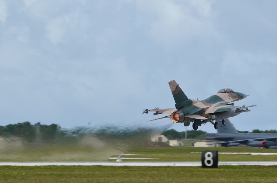 An F-16C Fighting Falcon attached to the 18th Aggressor Squadron, Eielson Air Force Base, Alaska, takes off for dissimilar air combat training during Exercise Cope North 2014 on Andersen Air Force Base, Guam Feb. 21, 2014. Cope North is a multilateral field training exercise that features a full spectrum of fighters, bombers, transport, refueling, and command and control aircraft and is designed to improve combat readiness, develop a synergistic disaster response, and increase interoperability between partner nations. (U.S. Air Force photo by Senior Airman Katrina M. Brisbin/Released)