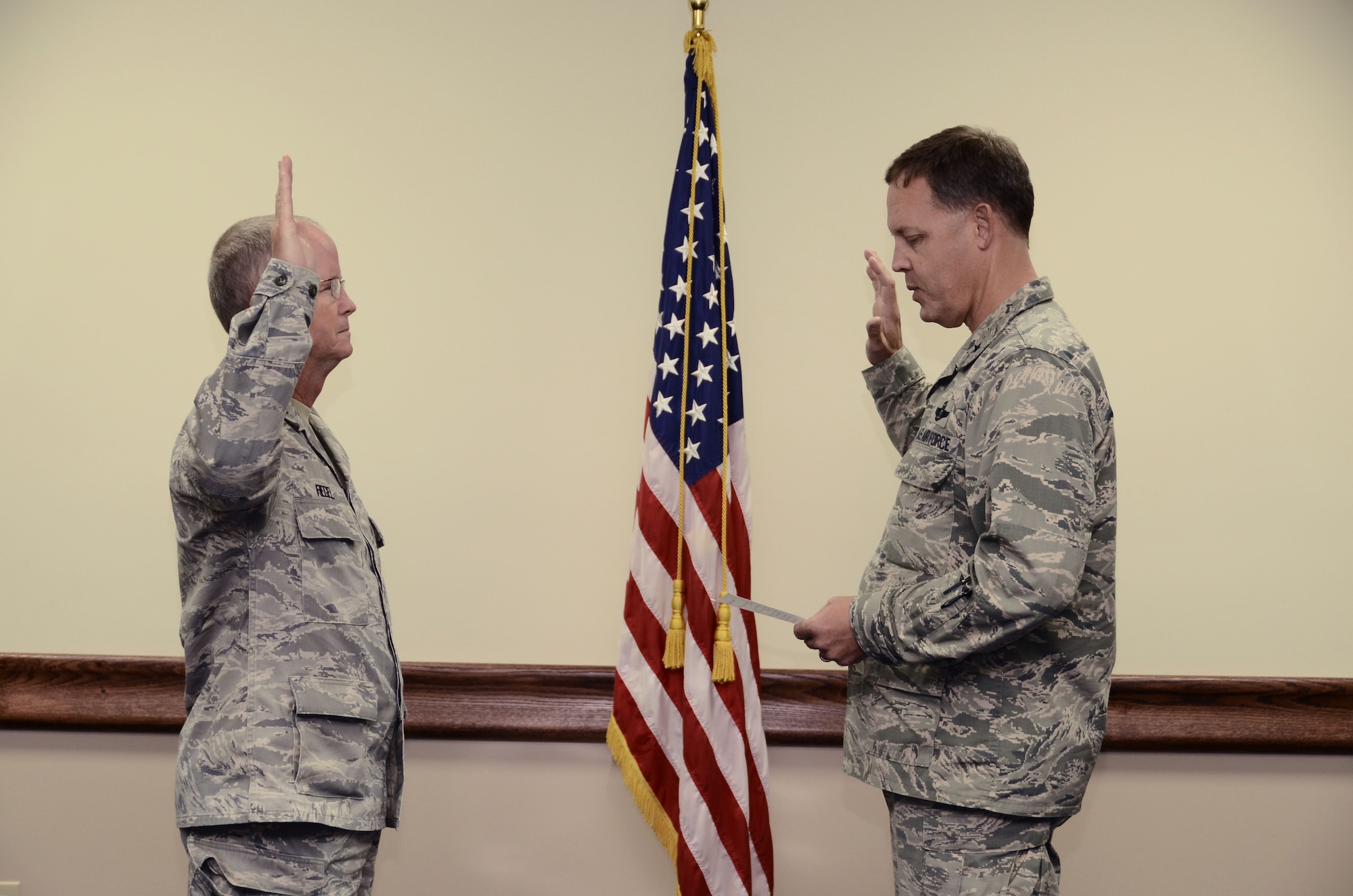 Lt. Col. Driller Fiegel is sworn in as the new 36th Wing Inspector General by Brig. Gen. Steven Garland, 36th Wing Commander, Feb. 11, 2014, on Andersen Air Force Base, Guam. The IG implements the complaint resolution and fraud, waste and abuse programs to find any issues affecting the organization and holds exercise and inspection programs to ensure everything is ready for the wing to meet operational requirements. (U.S. Air Force photo by Airman 1st Class Amanda Morris/Released)