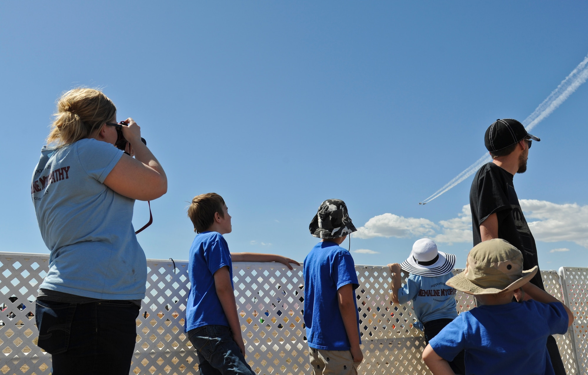 The Schow family watches the U.S. Air Force Air Demonstration Squadron Thunderbirds during their practice performance Mar. 14 at Luke Air Force Base. Samuel and Aidan, brothers, both suffer from a disorder called nemaline myopathy. Nemaline myopathy is a disorder that primarily affects skeletal muscles, which are muscles that the body uses for movement. (U.S. Air Force Photo by Staff Sgt. Darlene Seltmann)