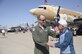 Lt. Col. Chris Bacon, 308th Fighter Squadron commander, coins 1st Lt. Ken Sadick, a World War II veteran, March 15 at Luke Air Force Base's Open House and Air Show. Sadick, 90 years old, graduated from Luke Field in March 1944, receiving his wings exactly 70 years ago this month. (U.S. Air Force photo by Staff Sgt. Timothy Boyer) 

