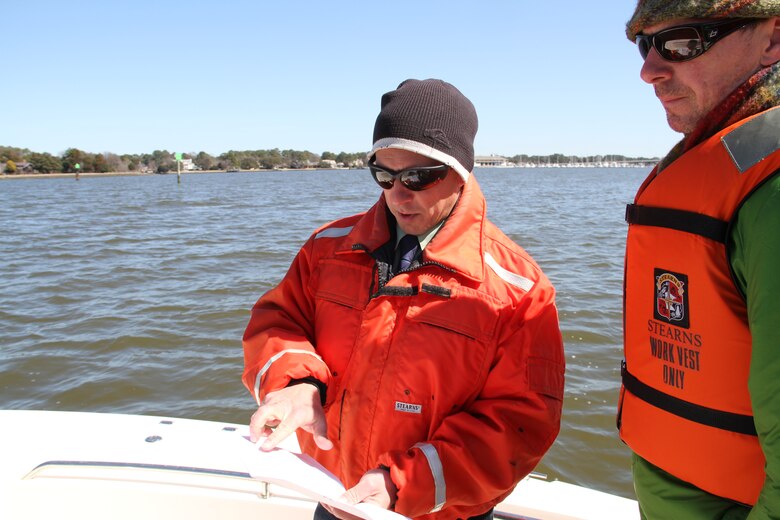 Keith Lockwood (left), chief, Norfolk District Technical Support Section and supervisory environmental scientist, shows the reef locations to environmental reporter Aaron Applegate of The Virginian-Pilot. The reefs at Hoffler Creek and Gilligan Creek have been completed. After the Norfolk International Terminal reef location is completed, there are two remaining reefs to be constructed, one in the western branch of the Elizabeth River at Baines Creek, and one in the southern branch of the river at Blows Creek. Six million spat-on-shell oysters will be seeded on six oyster reefs this spring. The project will be completed in June 2014. All of the reefs will be permanent oyster sanctuaries. 