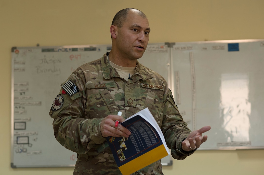 Senior Master Sgt. Carmelo Vega Martinez teaches Afghan air force airmen the English language during a class, Feb. 23, 2014, Kabul, Afghanistan. When not volunteering to teach English, Vega Martinez advises the Afghan air force on how to establish and sustain a recruiting service. Vega Martinez, a Ponce, Puerto Rico native, is deployed from the 368th Recruiting Squadron, Hill Air Force Base, Utah. Airmen from the 438th AEW/NATC-A are playing a vital role in Operation Enduring Freedom as advisers tasked with aiding the Afghan government in establishing an operational and sustainable Afghan Air Force. (U.S. Air Force photo/Tech. Sgt. Jason Robertson)
 
