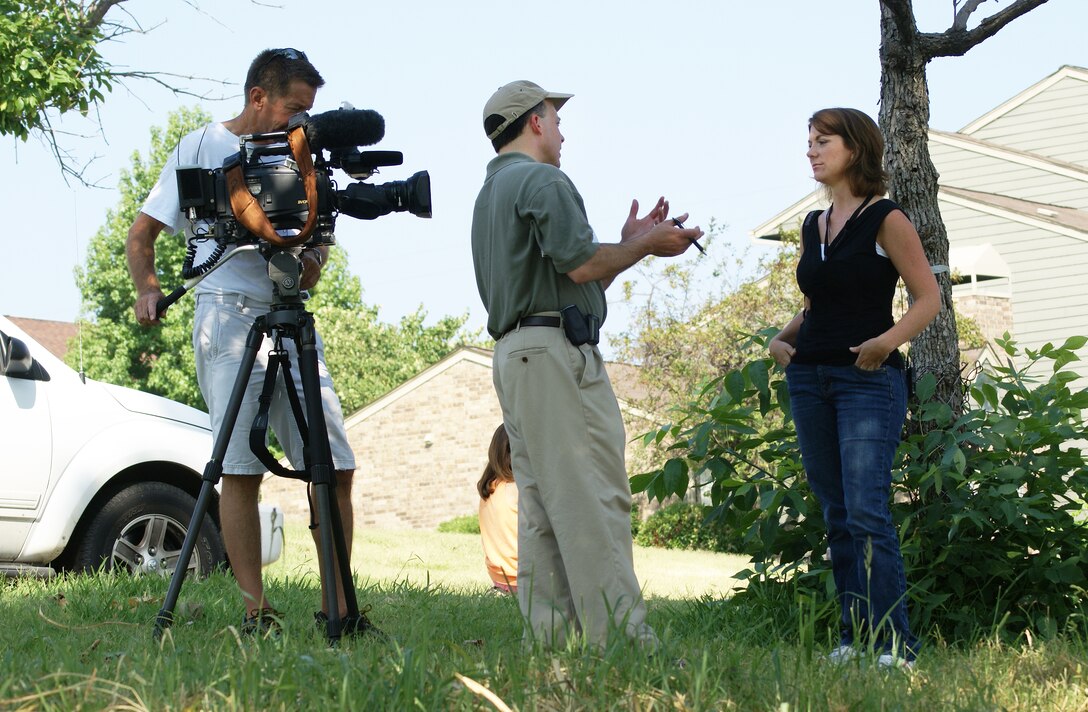 Tulsa District Biologist Tonya Dunn, far right, is interviewed by a reporter about the endangered least tern which nests on sandbars in the Arkansas River within the district. Dunn's work involves ensuring the protection of the species.                   