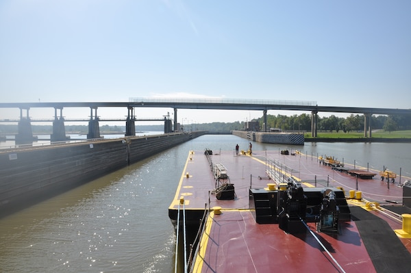 A barge approaches a lock along the McClellen-Kerr Arkansas River Navigation System. The system serves Oklahoma as a marine highway to the Gulf of Mexico and the world at large.