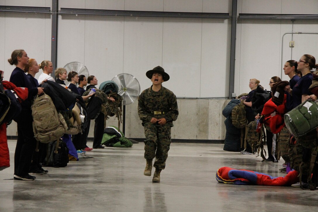 Sgt. Britni M. Garcia Green, a Platoon 4017, Company N, 4th Recruit Training Battaltion, Marine Corps Recruit Depot Parris Island drill instructor, shouts the command "eyeballs"  during Recruiting Station Kansas City's all-hands female pool function at Building 712 at 9th Marine Corps District Headquarters March 15, 2014. The command of eyeballs is used by drill instructors to instruct recruits to look at them as they are about to give instruction. Poolees from all the Recruiting Sub-Stations in the RS were on-hand for the event.