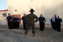Sgt. Britni M. Garcia Green, a Platoon 4017, Company N, 4th Recruit Training Battaltion, Marine Corps Recruit Depot Parris Island drill instructor, leads female poolees during warm-up stretches during Recruiting Station Kansas City's all-female pool function at 9th Marine Corps District's Building 712 March 15, 2014. The poolees were instructed on close-order drill, what to expect during recruit training, and hygiene. Poolees from all the Recruiting Sub-Stations in the RS were on-hand for the event.