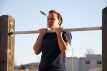 Olivia G. Ortiz, a Recruiting Sub-Station Gladstone poolee, performs a flexed-arm hang during Recruiting Station Kansas City's all-female pool function outside 9th Marine Corps District's Building 712 March 15, 2014. The poolees were instructed on close-order drill, what to expect during recruit training, and hygiene by female drill instructors. They also performed a mock Inital Strength Test with consisted of the flexed-arm hang, crunches and 1.5-mile run. Poolees from all the Recruiting Sub-Stations in the RS were on-hand for the event.