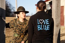 Sgt. Britni M. Garcia Green, a Platoon 4017, Company N, 4th Recruit Training Battaltion, Marine Corps Recruit Depot Parris Island drill instructor, instructs a female poolee to speak with intensity and volume during Recruiting Station Kansas City's all-female pool function outside 9th Marine Corps District's Building 712 March 15, 2014. The poolees were instructed on close-order drill, what to expect during recruit training, and hygiene and also performed a mock Inital Strength Test with consisted of the flexed-arm hang, crunches and 1.5-mile run. Poolees from all the Recruiting Sub-Stations in the RS were on-hand for the event.