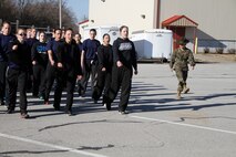 Sgt. Britni M. Garcia Green, a Platoon 4017, Company N, 4th Battaltion, Marine Corps Recruit Depot Parris Island drill instructor, teaches poolees the basics of marching and drilling during Recruiting Station Kansas City's all-female pool function outside 9th Marine Corps District's Building 712 March 15, 2014. The poolees were instructed on close-order drill, what to expect during recruit training, and hygiene and also performed a mock Inital Strength Test with consisted of the flexed-arm hang, crunches and 1.5-mile run. Poolees from all the Recruiting Sub-Stations in the RS were on-hand for the event.