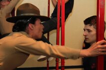 Sgt. Britni Garcia-Green, a drill instructor with 4th Recruit Training Battalion in Parris
Island, S.C., instructs a poolee to mount the pull up bar at RS Kansas
City's family night March 11. Garcia-Green is one of the first Marines the
female poolees will meet when they arrive for training at the Marine Corps'
only recruiting depot for females, at Parris Island. 
