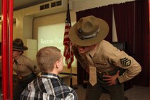 Staff Sgt. Robert Surozenski, a drill instructor from Marine Corps
Recruiting Depot San Diego motivates a poolee at Recruiting Station Kansas
City's Drill instructor night March 11. The drill instructors were there to
give poolees preparing to ship to boot camp a glimpse at what recruit
training will be like.