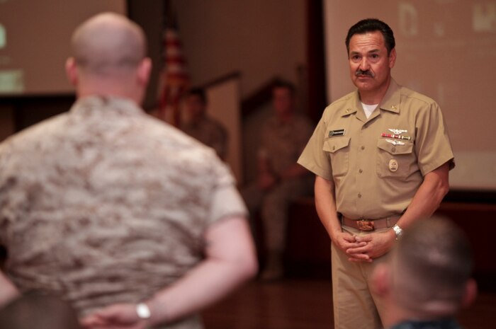 Master Chief Petty Officer Marco Ramirez, Pacific Fleet master chief, listens to a sailor's question during an all-hands call at the Pacific View Event Center aboard Camp Pendleton, Calif., March 12, 2014. The address was part of one of Ramirez's stops at Camp Pendleton where he visited Marines and sailors of the I Marine Expeditionary Force, the Wounded Warrior Battalion, the Wounded Warrior Regiment Marine Corps Trials, Assault Craft Unit 5 and Naval Hospital Camp Pendleton.