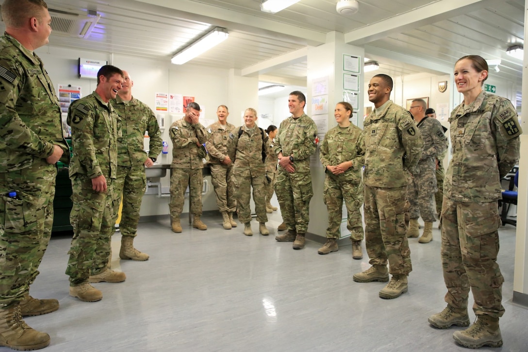 U.S. Army soldiers taking part in Operation Proper Exit (left) converse and interact with medical personnel assigned to Task Force 31, (a joint combat hospital contingent) aboard Camp Bastion, Helmand province, Afghanistan, March 13, 2014. Operation Proper Exit allows service members who received extreme injuries to return to the battle space for help with healing and closure, connect with service members currently deployed, and leave in the appropriate manner they were not previously afforded due to their injuries.
(Official U.S. Marine Corps photo by Lance Cpl. Darien J. Bjorndal, Marine Expeditionary Brigade Afghanistan/Released)