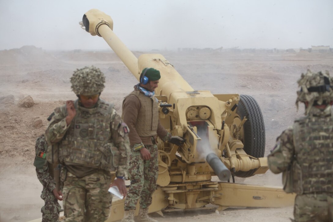 Afghan artillerymen with the 215th Corps, Afghan National Army, fire a D-30 122 mm howitzer during a live-fire exercise aboard Camp Shorabak, Helmand province, Afghanistan, March 12, 2014. The exercise was the culminating event of the six-week D-30 instructor course, which proved the Afghan soldiers ability to instruct future artillerymen in map plotting and firing of the D-30. (U.S. Marine Corps photo by Cpl. Joshua Young)