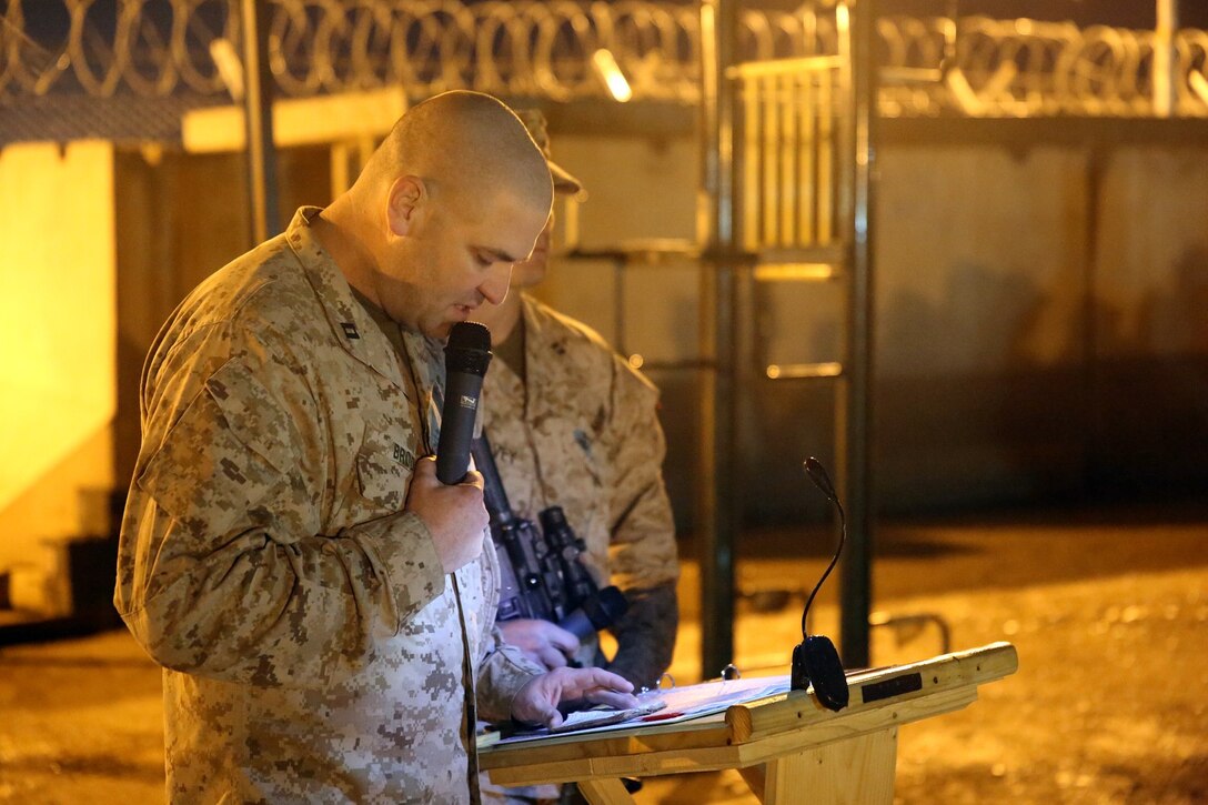Navy Lt. Andrew Brod, chaplain, 1st Battalion, 7th Marine Regiment, says a prayer during a midnight transfer of authority ceremony aboard Camp Leatherneck, Afghanistan, March 15, 2014. After a seven-month deployment, 3rd Battalion, 7th Marine Regiment, transferred their battlespace and responsibilities to 1st Bn., 7th Marines. “Our team is excited to do our part during a historic moment in the history of Afghanistan, and we’re able to do that with the support of our families.” said Lt. Col Seth Yost, the commanding officer of 1st Bn., 7th Marines.