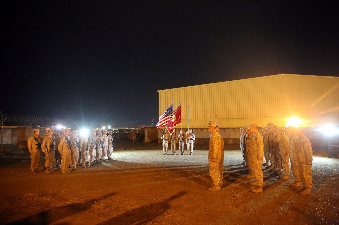 Marines and sailors stand at attention during a midnight transfer of authority ceremony aboard Camp Leatherneck, Afghanistan, March 15, 2014. After a seven-month deployment, 3rd Battalion, 7th Marine Regiment, transferred their battlespace and responsibilities to 1st Battalion, 7th Marine Regiment. “Our team is excited to do our part during a historic moment in the history of Afghanistan, and we’re able to do that with the support of our families.” said Lt. Col Seth Yost, the commanding officer of 1st Bn., 7th Marines.