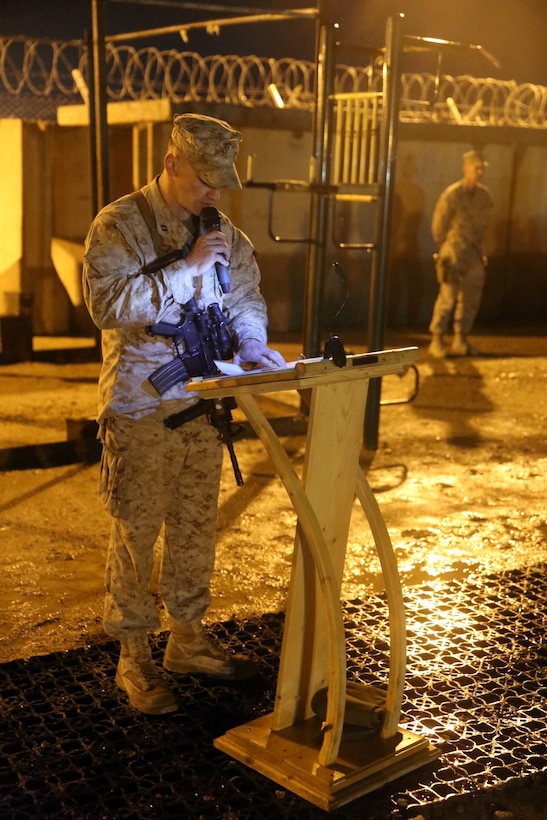 Captain James Cove, company commander, 3rd Battalion, 7th Marine Regiment, speaks about the battalion during a midnight transfer of authority ceremony aboard Camp Leatherneck, Afghanistan, March 15, 2014. After a seven-month deployment, 3rd Bn., 7th Marines, transferred their battlespace and responsibilities to 1st Battalion, 7th Marine Regiment. “Our team is excited to do our part during a historic moment in the history of Afghanistan, and we’re able to do that with the support of our families.” said Lt. Col Seth Yost, the commanding officer of 1st Bn., 7th Marines.