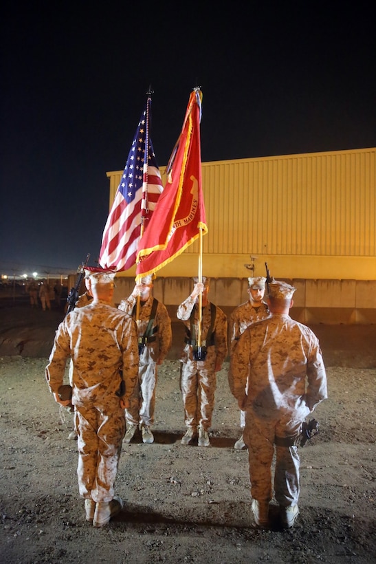 Sergeant Major Chasen Getty, left, sergeant major, 1st Battalion, 7th Marine Regiment, and Lt. Col. Seth Yost, right, commanding officer, 1st Bn., 7th Marines, stand at attention during a midnight transfer of authority ceremony aboard Camp Leatherneck, Afghanistan, March 15, 2014. After a seven-month deployment, 3rd Battalion, 7th Marine Regiment, transferred their battlespace and responsibilities to 1st Bn., 7th Marines. “Our team is excited to do our part during a historic moment in the history of Afghanistan, and we’re able to do that with the support of our families.” said Lt. Col Seth Yost, the commanding officer of 1st Bn., 7th Marines.