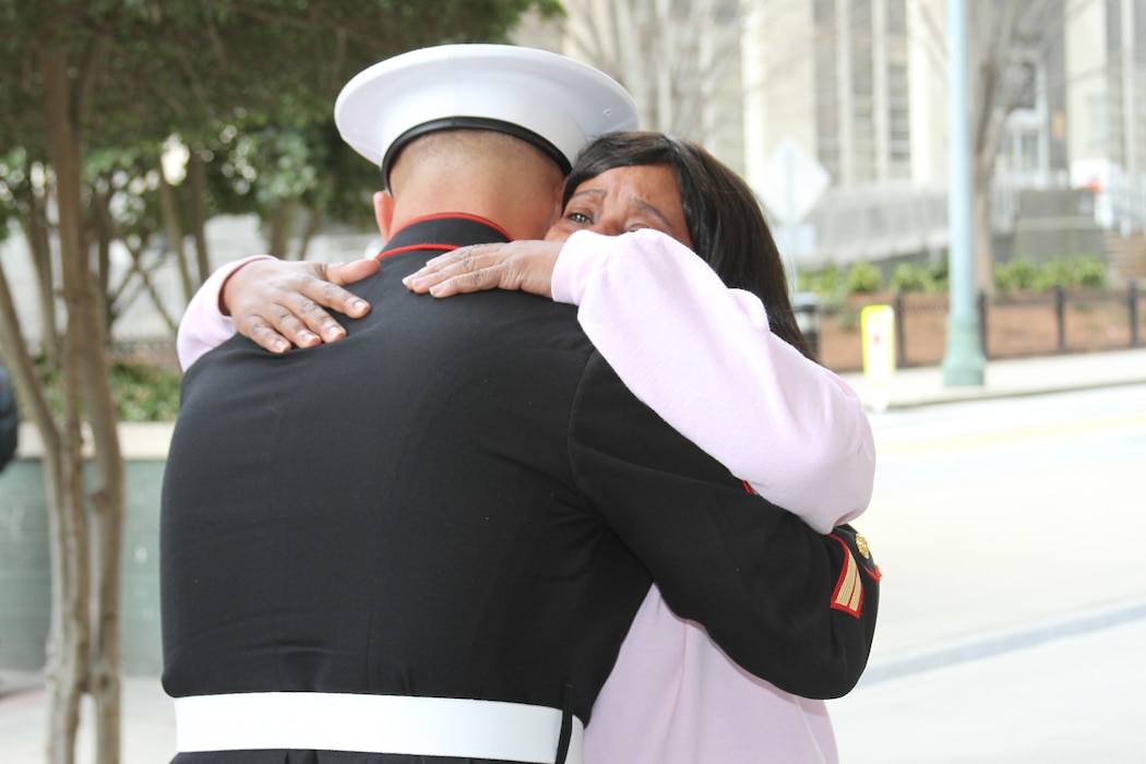Tracey McGinnis hugs Sgt. Matthew Sullivan upon meeting him outside Grady Memorial Hospital in Atlanta, March 15. Sullivan, a native of Lawrenceville, GA, was the first responder at the scene of an accident involving Tracey’s son Taray. Sullivan assisted Taray after his truck caught fire on I-85N at Old Peachtree Road, March 9. Sullivan is a recruiter with Recruiting Sub-Station Buford, Recruiting Station Atlanta. (U.S. Marine Corps photo by Sgt. Courtney G. White/released)
