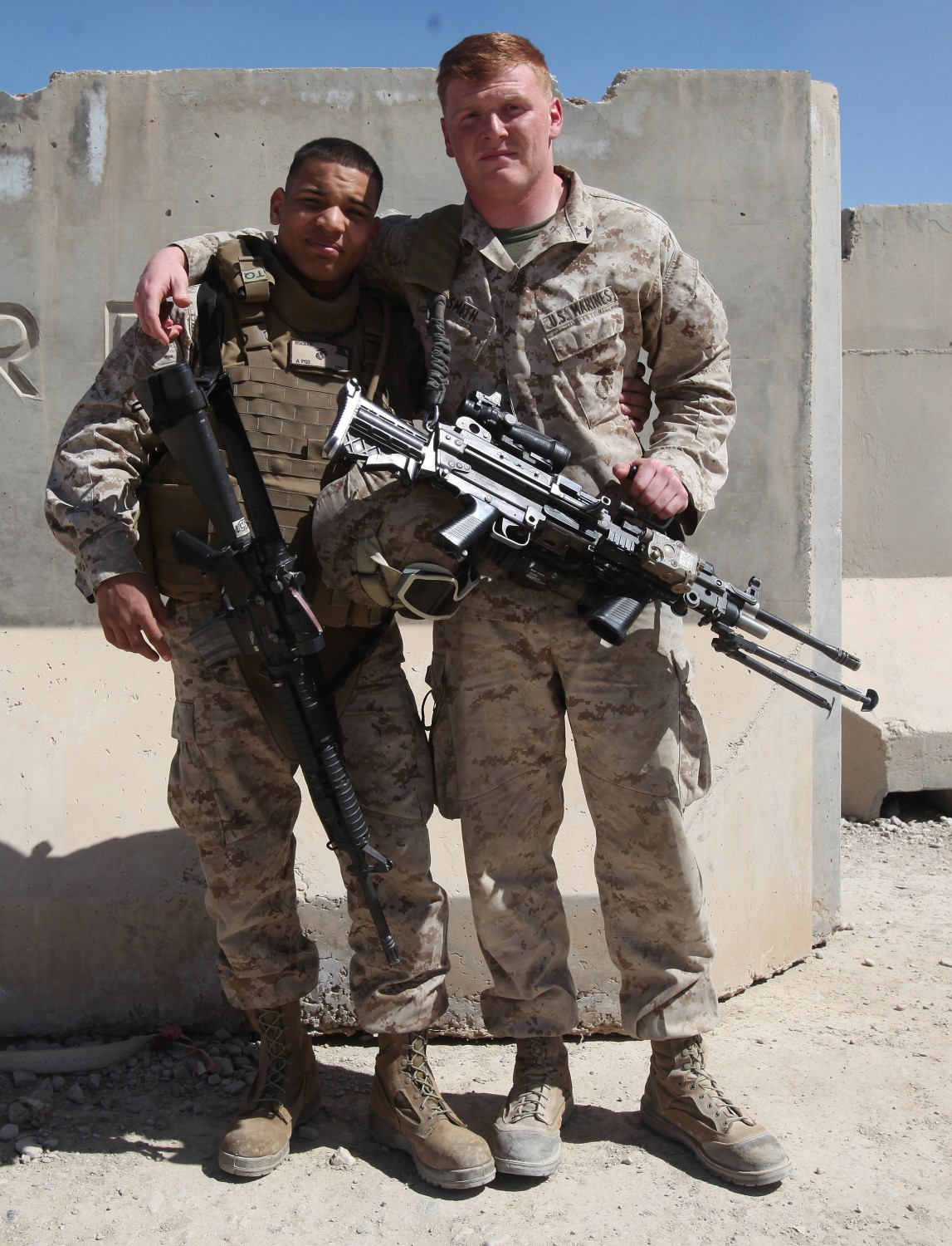 Lance Cpl. Donald Rucker, left, a maintenance administration clerk with Marine Heavy Helicopter Squadron 466, Marine Aircraft Group - Afghanistan, and Lance Cpl. Ian Smith, a mortarman with Weapons Company, 3rd Battalion, 7th Marine Regiment, pose for a photo after reuniting aboard Camp Leatherneck, Afghanistan, March 11, 2014. The brothers reconnected for the first time after being separated for more than a year and a half while serving in the Marine Corps. (U.S. Marine Corps photo by Cpl. Cody Haas/ Released)