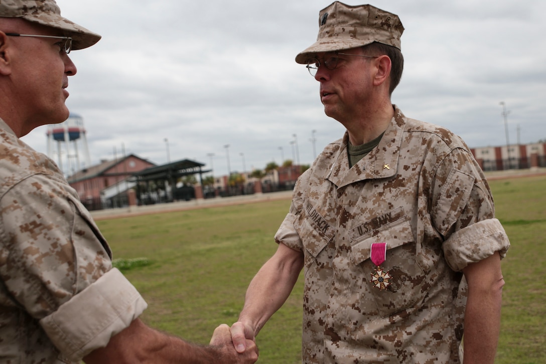 Navy Capt. William A. Wildhack III, chaplain for the 4th Marine Division, receives the Legion of Merit at the Marine Corps Support Facility New Orleans, March 17, 2014. According to the citation, Wildhack exhibited exceptionally meritorious conduct in the performance of outstanding service as force chaplain and deputy force chaplain from August 2011 to September 2013. As the first Reserve-component chaplain to serve as both deputy and force chaplain, Wildhack’s leadership, unequaled vision and superior managerial increased awareness of Reserve-component issues among active-component counterparts and the chaplain leadership.