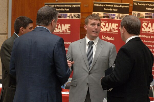 Medal of Honor recipient Marine Sgt. Dakota Meyer (center) talks with participants during a break at the 3rd Annual Small Business Training Forum at the Tennessee State University Avon Williams Campus today in Nashville, Tenn. , March 13, 2014.Sgt. Meyer is currently the president of Dakota Meyer Enterprises, Incorporated and most recently received his first federal contract from the Corps of Engineers.   