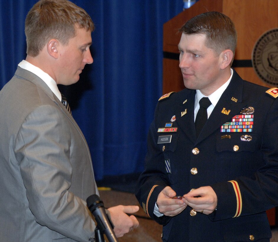 Lt. Col. John L. Hudson, Nashville District commander and Society of American Military Engineers Nashville Post president, (right) presents Medal of Honor recipient Marine Sgt. Dakota Meyer a command coin and thanks him for coming to the Nashville District to speak at the 3rd Annual Small Business Training Forum at the Tennessee State University Avon Williams Campus today in Nashville, Tenn.  