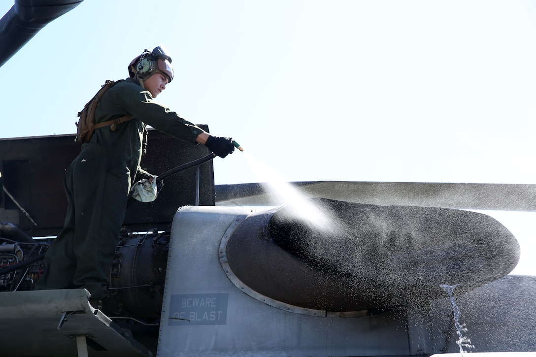 A flightline mechanic with the 11th Marine Expeditionary Unit’s aviation combat element, Marine Medium Tiltrotor Squadron 163, cleans the engine bay of a CH-53E Super Stallion to ensure a constant state of readiness for flight operations during Realistic Urban Training Marine Expeditionary Unit Exercise 14-1 aboard Fort Hunter Liggett, Calif., March 16. RUTMEUEX is intended to be the first large-scale opportunity for integration between the ground combat element, aviation combat element, logistics combat element and command element of the MEU. The training places its participants in environments similar those they’ll see during their upcoming deployment.
