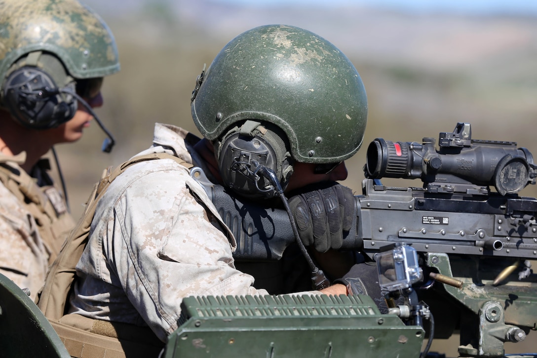 Marines with 1st Light Armored Reconnaissance, 2nd Battalion, 1st Marines, 11th Marine Expeditionary Unit, conduct live fire with M242 Bushmaster cannons and M240G machine guns on static targets during Realistic Urban Training Marine Expeditionary Unit Exercise 14-1 at Fort Hunter Liggett, Calif., March 17, 2014.  RUTMEUEX will prepare the 11th MEU Marines for their upcoming deployment, enhancing Marines' combat skills in environments similar to those they may find in future missions.  (U.S. Marine Corps photo by Gunnery Sgt. Rome M. Lazarus/Released)