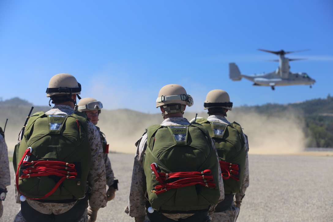 Marines with the Maritime Raid Force, 11th Marine Expeditionary Unit, wait to board an MV-22B Osprey during Realistic Urban Training Marine Expeditionary Unit Exercise 14-1 at Fort Hunter Liggett, Calif., March 16, 2014.  RUTMEUEX will prepare the 11th MEU Marines for their upcoming deployment, enhancing Marines' combat skills in environments similar to those they may find in future missions.  (U.S. Marine Corps photo by Lance Cpl. Laura Y. Raga/Released)
