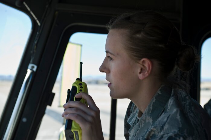 U.S. Air Force Staff Sgt. Heather Jones, 99th Civil Engineer Squadron firefighter, responds to a BAK-12 aircraft arresting barrier change on the flightline March 12, 2014, at Nellis Air Force Base, Nev. With heavier aircraft using the barriers, changes occur regularly. (U.S. Air Force photo by Senior Airman Christopher Tam)