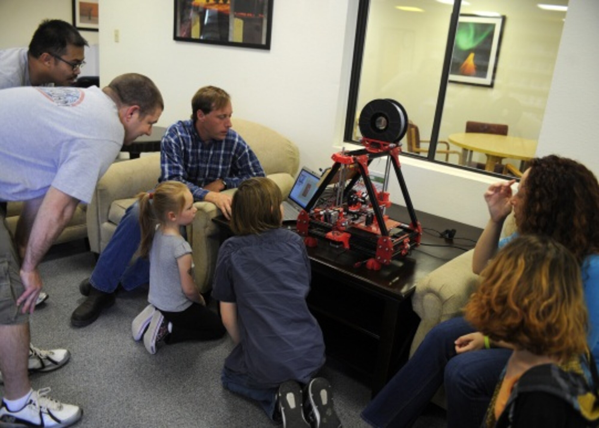 Ray Peters, 27th Special Operations Force Support Squadron technical information specialist, demonstrates 3-D printers capabilities March 11, 2014, at Cannon Air Force Base, N.M. The demonstration was part of the Technology Fair, where military members and civilians alike were encouraged to learn how to make the most of their technological resources.  (U.S. Air Force photo/ Senior Airman Ericka Engblom)
