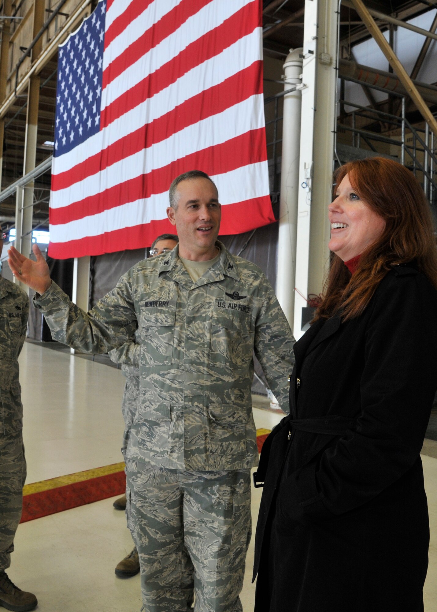 Col. Brian Newberry, 92nd Air Refueling Wing commander, speaks with Washington state Secretary of State, Kim Wyman, during a base tour at Fairchild Air Force Base, Wash., March 14, 2014. Wyman's visit allowed her to better understand Fairchild's day-to-day mission. (U.S. Air Force photo by Senior Airman Mary O'Dell/Released)
