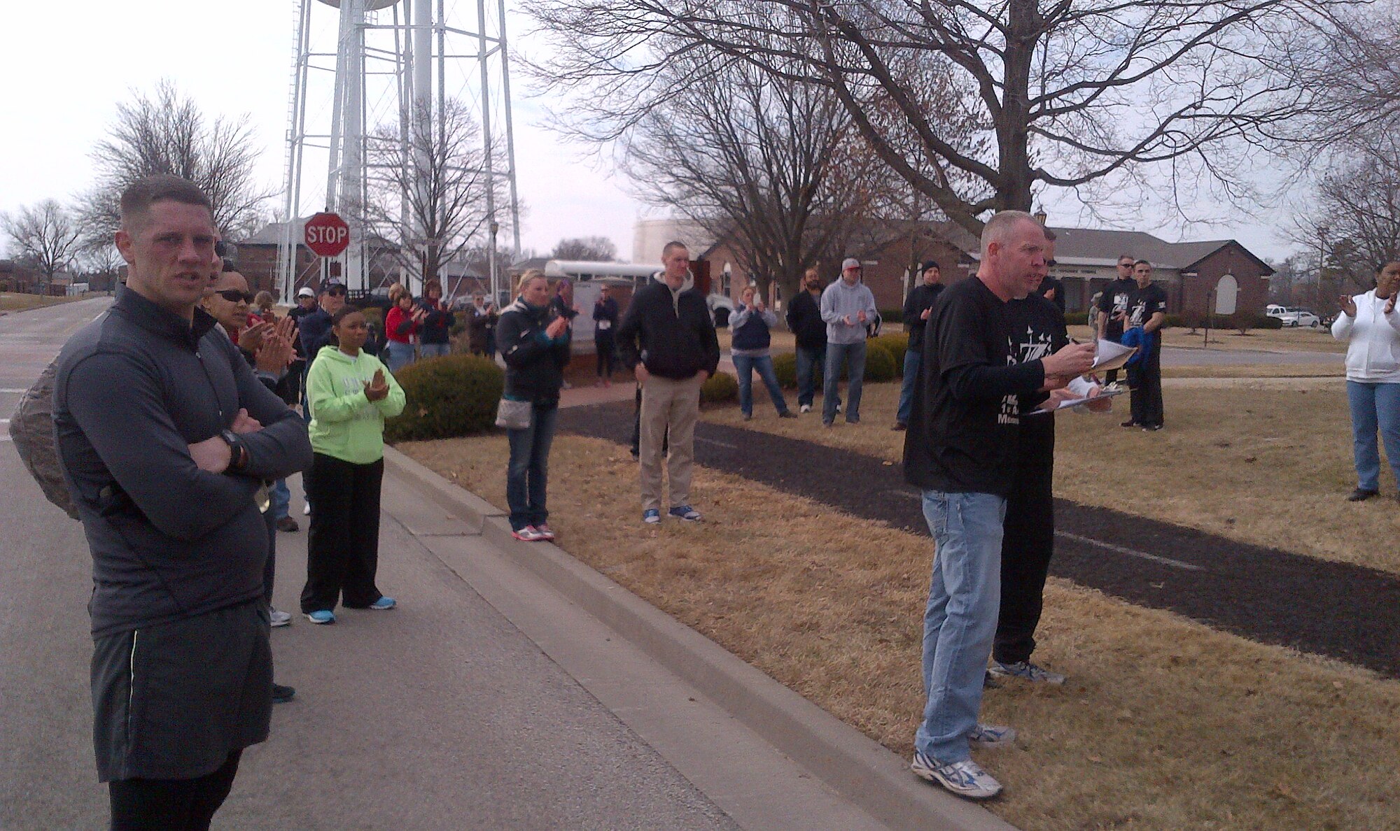 Runners wait for their teammates at the finish line of the A1C Zachary Cuddeback Memorial 5k March 1 at Scott Air Force Base, Ill. (U.S. Air Force photo)