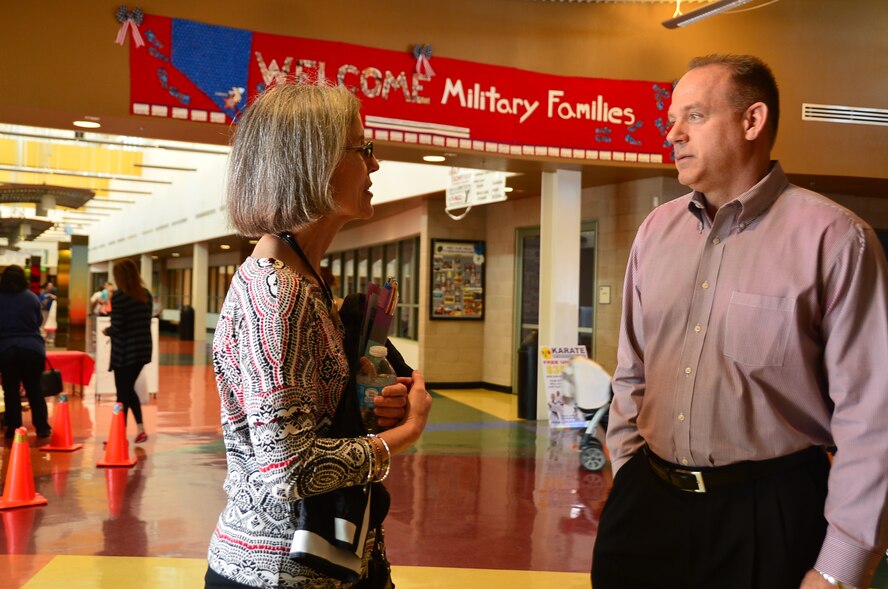 Katherine Hostage, wife of Gen. Mike hostage, commander of Air Combat Command, talks with Jeff Treslley, Las Vegas YMCA executive director, on programs available to 432nd Wing Airmen during her visit to the YMCA March 3, 2014. Hostage held a spouses’ forum to address issues facing family members of 432nd Wing Airmen. (U.S. Air Force photo by Staff Sgt. N.B./released)