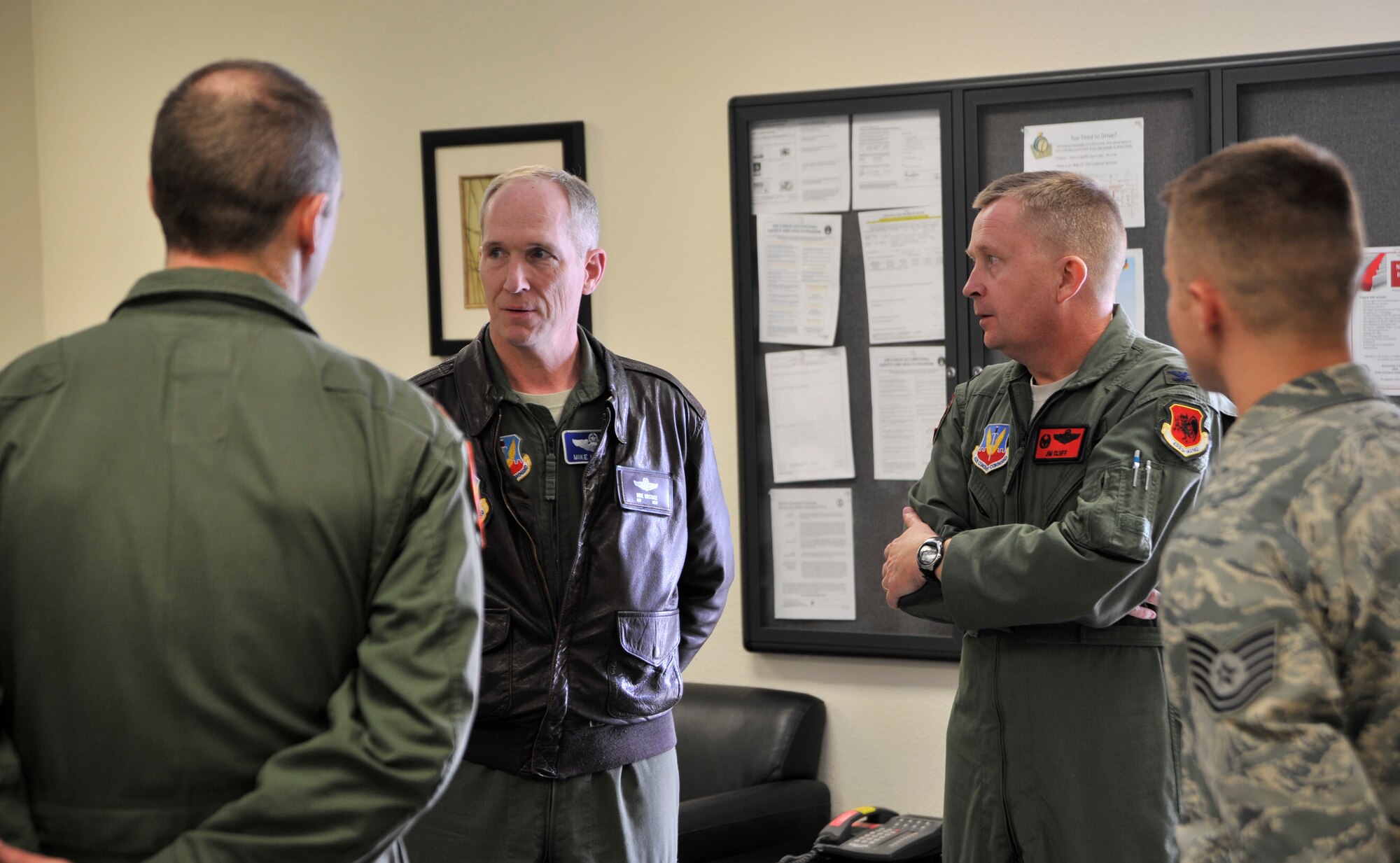 Gen. Mike Hostage, commander of Air Combat command, discusses quality-of-life issues with chapel staff members while visiting the Airman Ministry Center March 3, 2014. During a tour of the base, Hostage learned how the programs available at the AMC have helped meet Airmen’s spiritual needs. (U.S. Air Force photo by Airman 1st Class C.C./released)