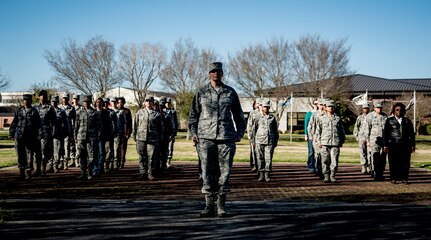 Colonel Judith Hughes, 628th Medical Group commander, leads an all-female flight of Airmen in a Retreat ceremony March 14, 2014, in honor of Women’s History Month at Joint Base Charleston – Air Base, S.C. Women’s History Month is an annual observance highlighting the contributions of women throughout history and in today’s society. (U.S. Air Force photo/ Senior Airman Dennis Sloan)
