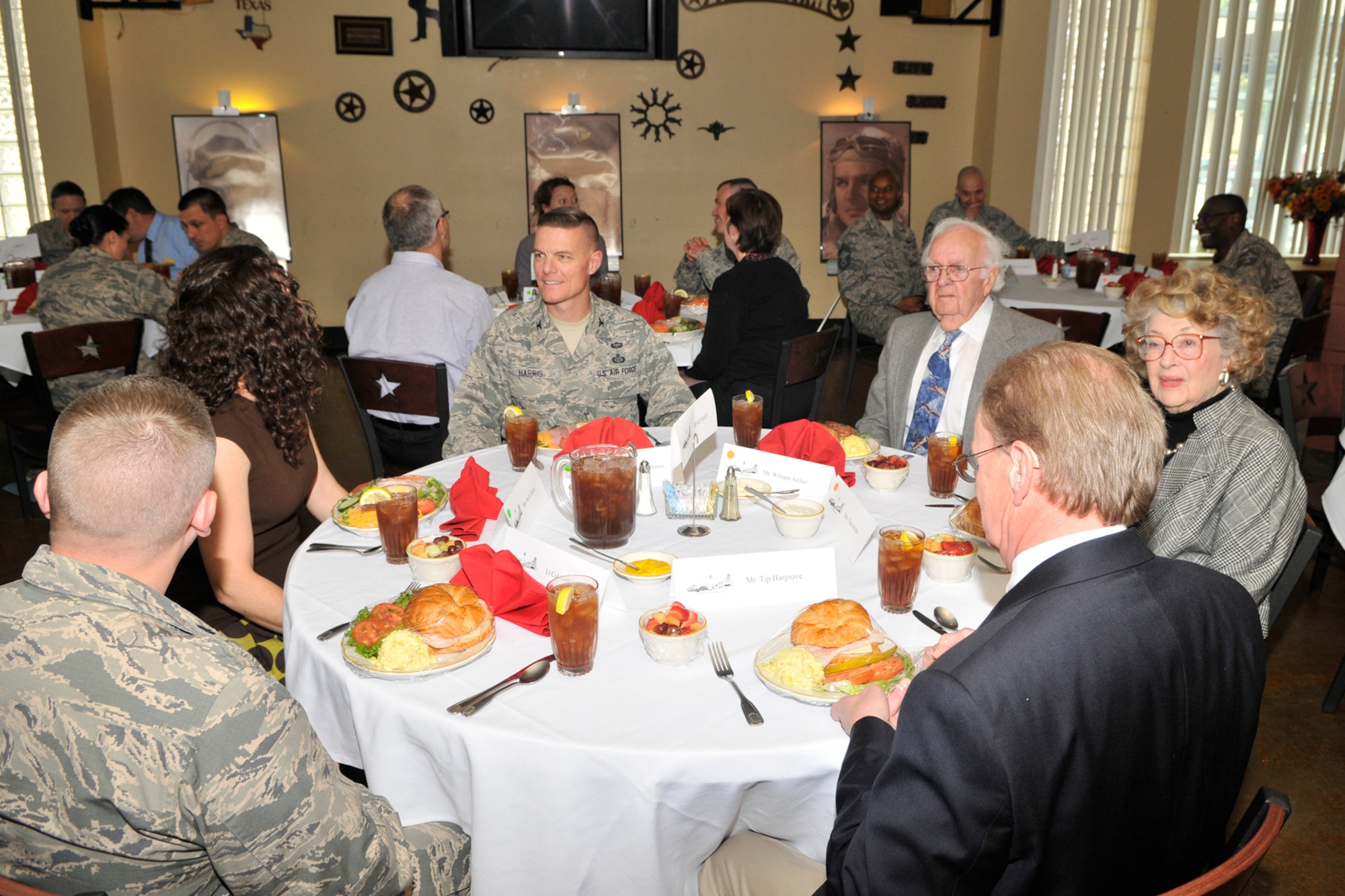 GOODFELLOW AIR FORCE BASE, Texas – William Archer, World War II Boeing B-17 Flying Fortress co-pilot, eats lunch with Col. Brendan Harris, 17th Training Group Commander, during his tour here March 7. Archer and his family have kept many pieces of memorabilia that help tell Archer’s story as a B-17 pilot. (U.S. Air Force photo/ Airman 1st Class Devin Boyer)