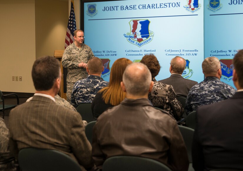Col. Jeffrey DeVore, Joint Base Charleston commander, speaks to the Honorary Commanders March 13, 2014, during their orientation tour of JB Charleston-Air Base, S.C. The Joint Base Charleston Honorary Commanders Program encourages an exchange of ideas, experiences, and friendship between key members of the local civilian community and the Charleston military community.  The program provides a unique opportunity for members of the Charleston area to shadow commanders of Air Force wings and groups, as well as Navy and tenant units at Joint Base Charleston. (U.S. Air Force photo/Senior Airman Ashlee Galloway)