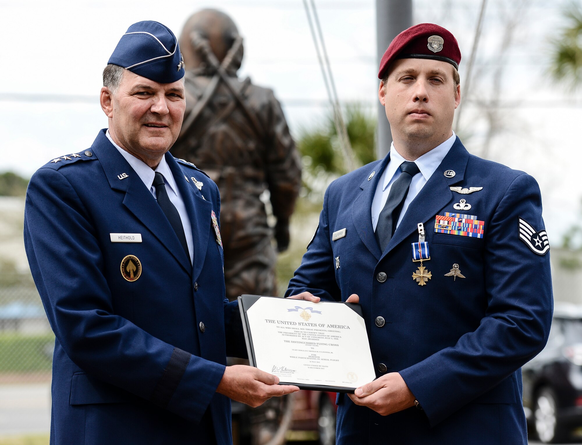NAVAL SUPPORT ACTIVITY PANAMA CITY, Fla. (March 11, 2014) -- Lt. Gen. Bradley Heithold, U.S. Air Force, Vice Commander, Headquarters U.S. Special Operations Command, Washington, D.C., presents Staff Sgt. Thomas Culpepper, U.S Air Force, with the Distinguished Flying Cross (with Valor) at the Naval Diving and Salvage Training Center (NDSTC).  Culpepper was awarded the Distinguished Flying Cross (with Valor) for heroism while participating in aerial flight during operations in the Middle East 2011 and is currently an instructor at NDSTC.  (U.S. Navy courtesy photo by Mass Communication Specialist 2nd Class Kevin B. Gray/Released)