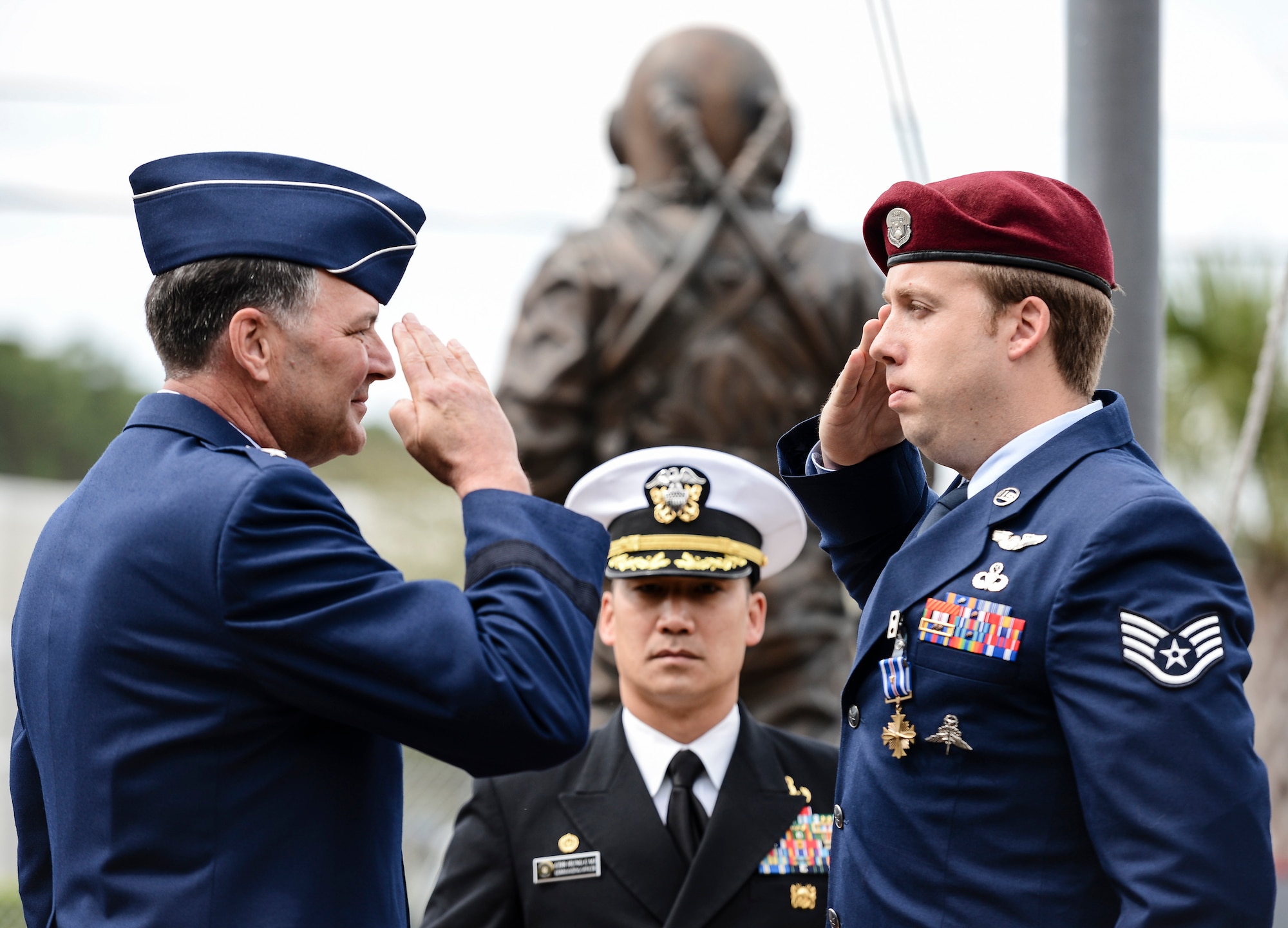 NAVAL SUPPORT ACTIVITY PANAMA CITY, Fla. (March 11, 2014) -- Lt. Gen. Bradley Heithold, U.S. Air Force, Vice Commander, Headquarters U.S. Special Operations Command, Washington, D.C., salutes Staff Sgt. Thomas Culpepper, U.S Air Force, after presenting him with the Distinguished Flying Cross (with Valor) at the Naval Diving and Salvage Training Center (NDSTC).  Culpepper was awarded the Distinguished Flying Cross (with Valor) for heroism while participating in aerial flight during operations in the Middle East 2011 and is currently an instructor at NDSTC.  (U.S. Navy courtesy photo by Mass Communication Specialist 2nd Class Kevin B. Gray/Released)
