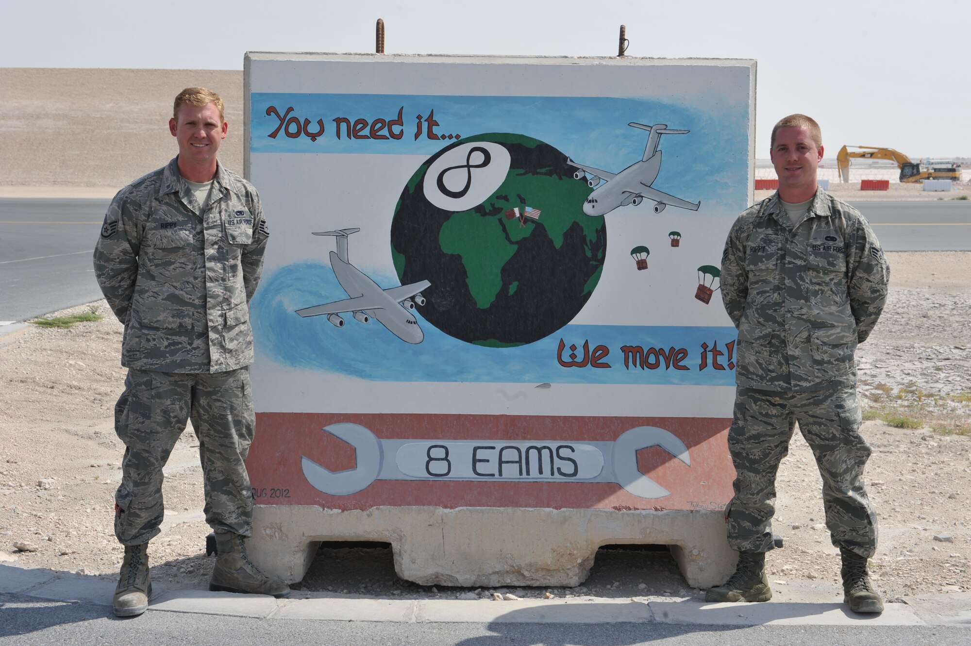 Staff Sgt. David Rippy and Senior Airman Mark Rippy, both reservists deployed from the 315th Aircraft Maintenance Squadron, Charleston Air Force Base, S.C., pose for a picture at Al Udeid Air Base, Qatar, March 11, 2014. Mark arrived in March and is the direct replacement for David at the 8th Expeditionary Aircraft Maintenance Squadron where both are hydraulic systems specialists supporting C-17 Globemaster IIIs who fly missions in support of Operation Enduring Freedom. (U.S. Air Force photo by Master Sgt. David Miller)
